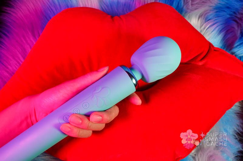 Maia Nala Wand Review: 5 Reasons to Love This Massager 8 Hand holding Maia Toys Nala waterproof wand massager with rumbly vibrations and textured head