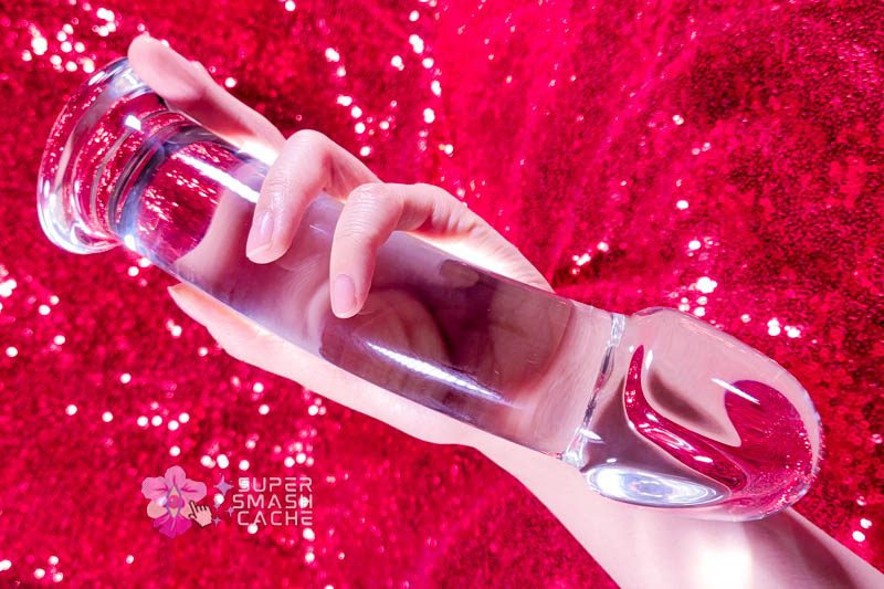 Extra large realistic mushroom tip glass dildo in hand
