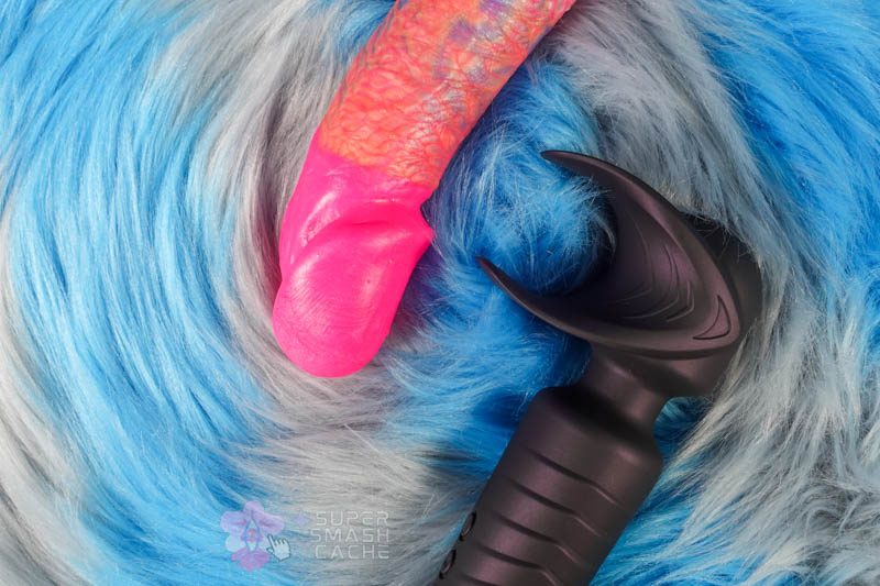 Man.wand Evo by Manwan penis vibrator next to Uberrime Aptus dildo