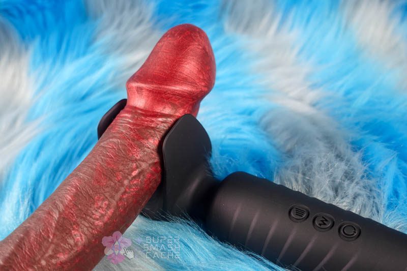 Close-up of Man.wand Evo's flexible wing design around a dildo