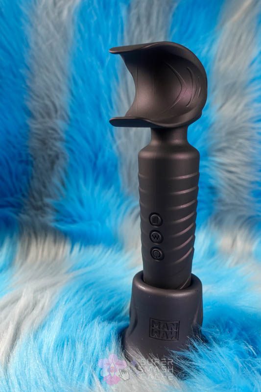 Man.wand Evo penis vibrator standing in Holden suction cup base adapter