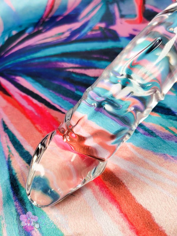 Close-up of Glas 10.5 inch double-headed glass dildo texture details, highlighting veining, ridge patterns, and head shape

