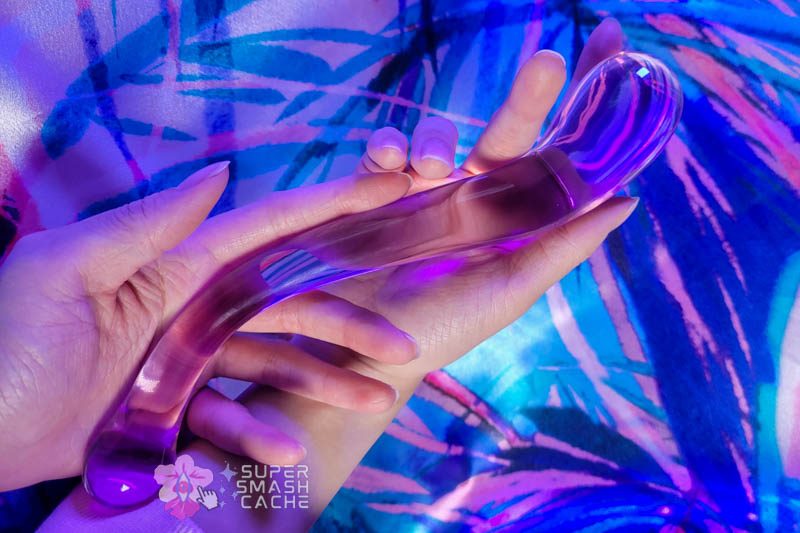 Beginner-Friendly Dildos: THE SOUL-SNATCHING STARTER PACK For All Your Hot Spots 5 JimmyJane Dillennia Gama S-curved deep penetration glass dildo in hands