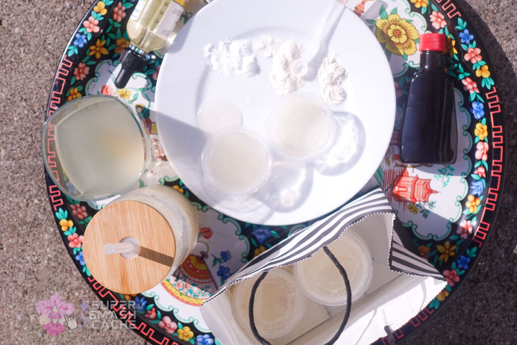 Ingredients for realistic fake cum recipe laid out flat, top-down view of semen substitute components