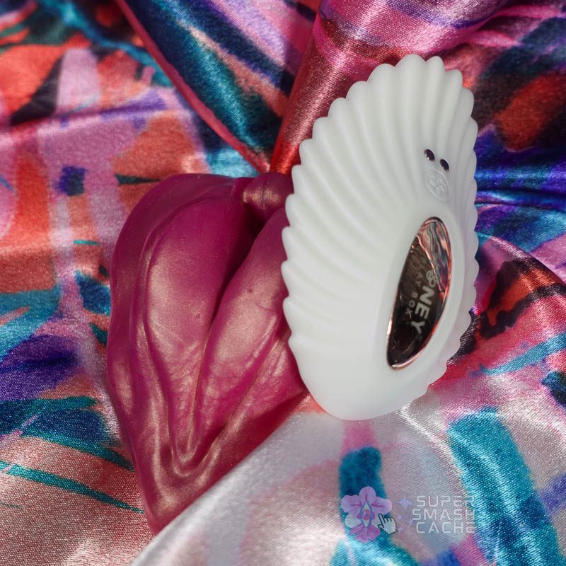 White Honey Play Box Pearl 2 Bluetooth panty vibrator next to Uberrime LaBae