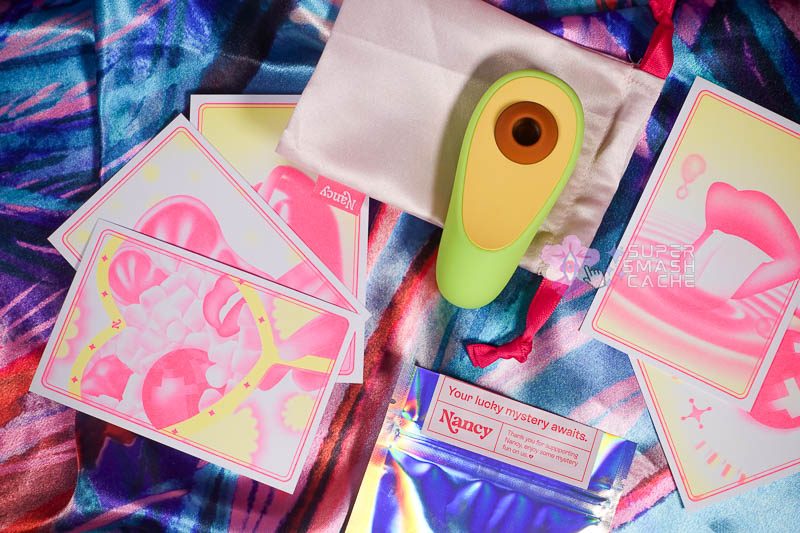 Nancy Avo & Lem Clit Toy Review: high performers or hype? 8 Hello Nancy Avo avocado clit toy, storage pouch, and promo cards