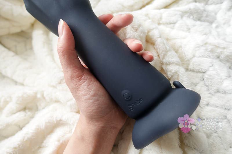 b-vibe fisting silicone dildo with vibrations control button and logo near suction cup base