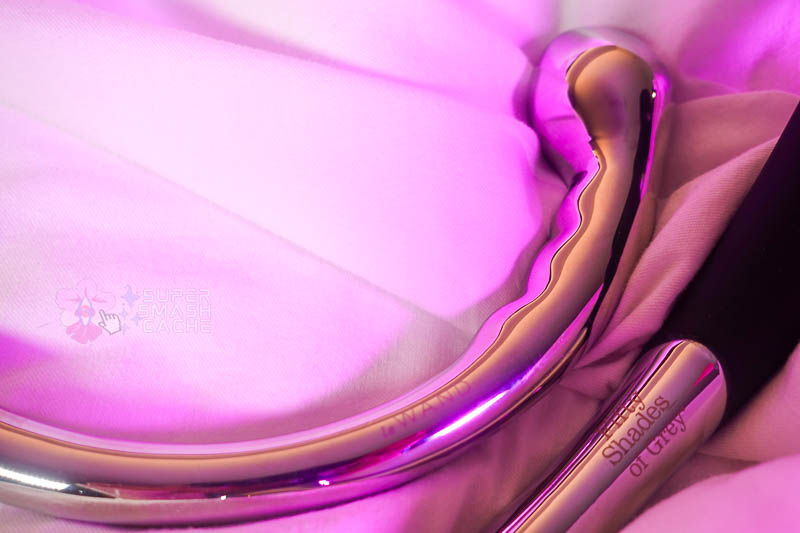 a close-up of the le wand hoop and fifty shades of grey sweet pressure logos