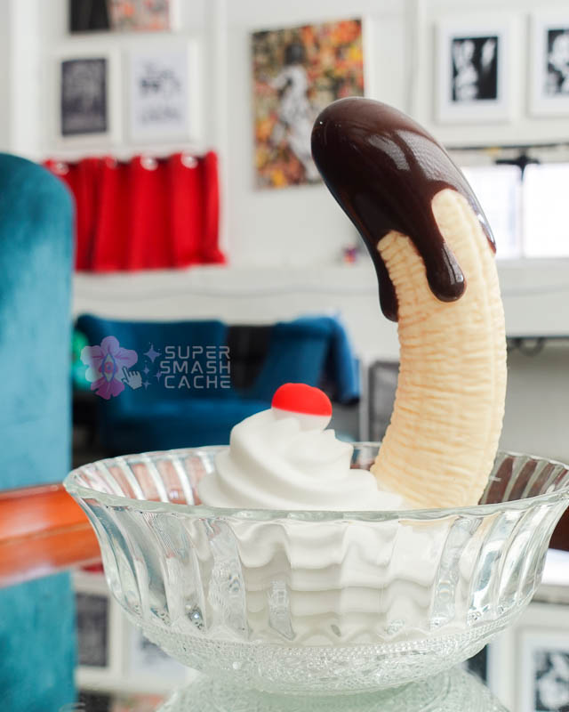 XR Brands Simply Sweet Chocolate Dipped Banana Split suction cup dildo with glossy fudge drips in silicone