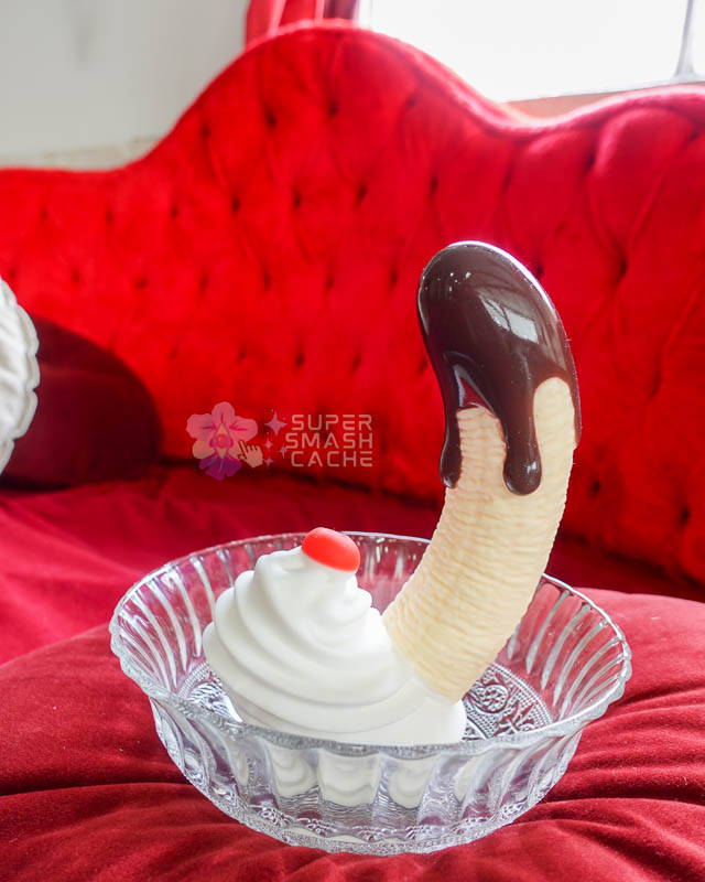 XR Brands Simply Sweet Banana Split dildo with whipped cream suction cup side view in bowl