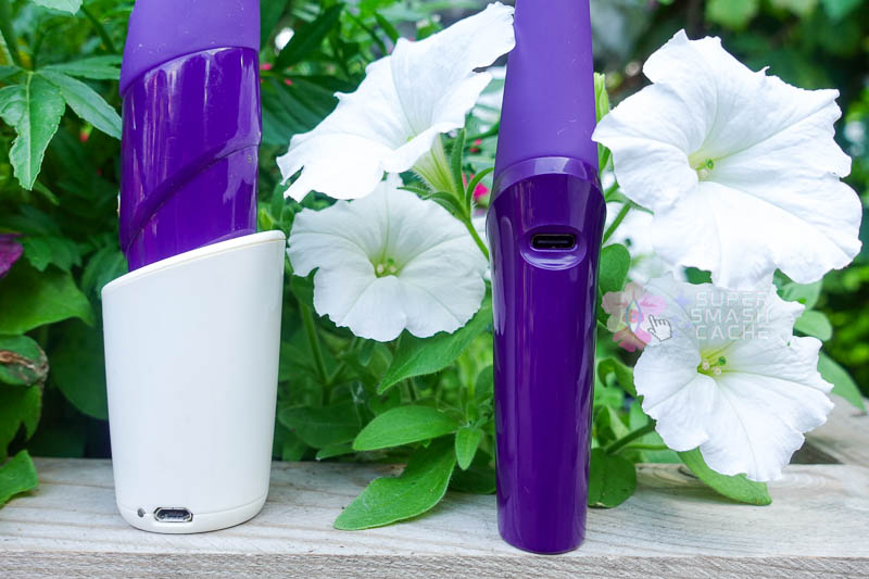 close-up of old  Zumio X charging dock with micro-USB port vs. Zumio X2 standing on flat base with micro-USB port on the side