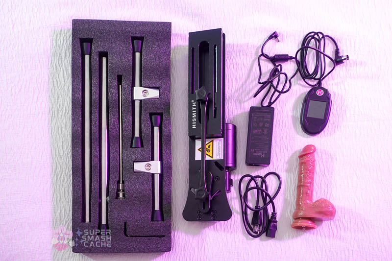 Hismith Premium 4.0 bag contents showing foam cushioning, platform legs, base, rods, cords, controller, adapter, and the included dildo